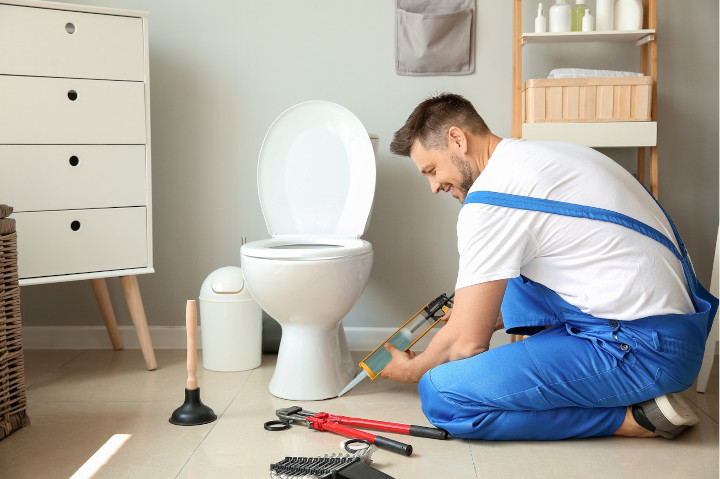Installation d'un wc par un plombier fixation au sol